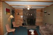 Large living area with a wood burning fireplace